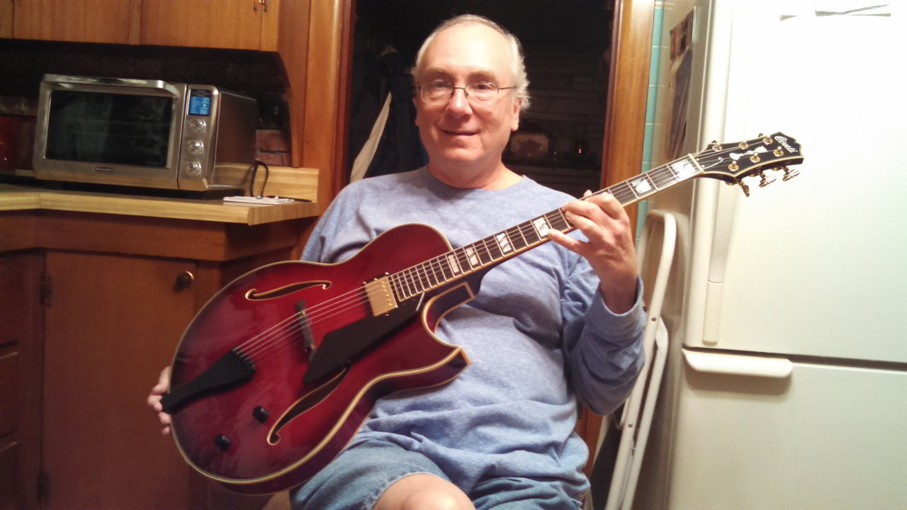 John McCarty with his Conti Heirloom Archtop Guitar