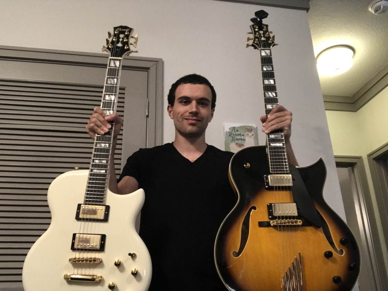Joseph Ahmad standing proud with a Conti Solid Body and a Conti Heirloom archtop