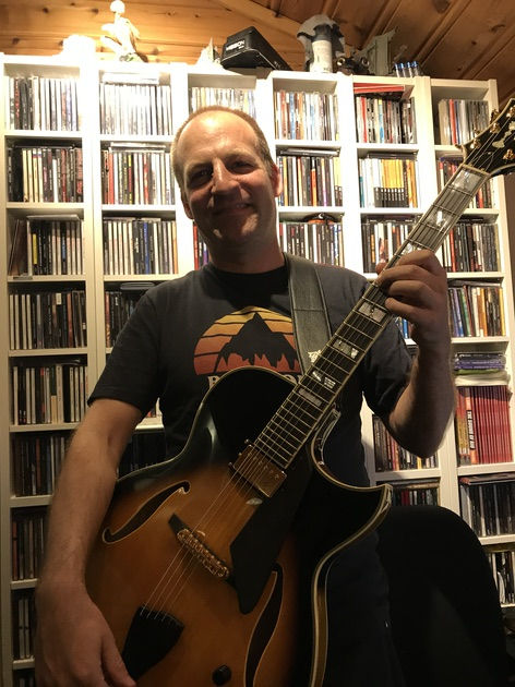 Skjalg holding his Conti Heirloom Archtop