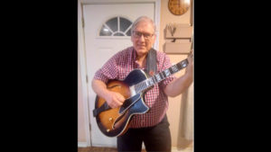 Dave Richardson proudly displays his Conti Equity archtop in Antique Sunburst