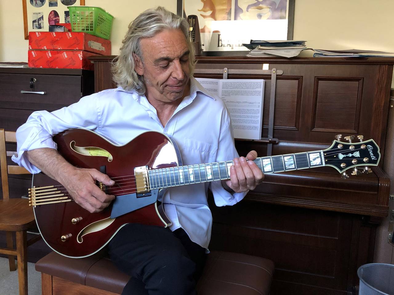 All the way in Australia, new owner Tony Silber enjoys his Port Wine Conti Entrada archtop guitar
