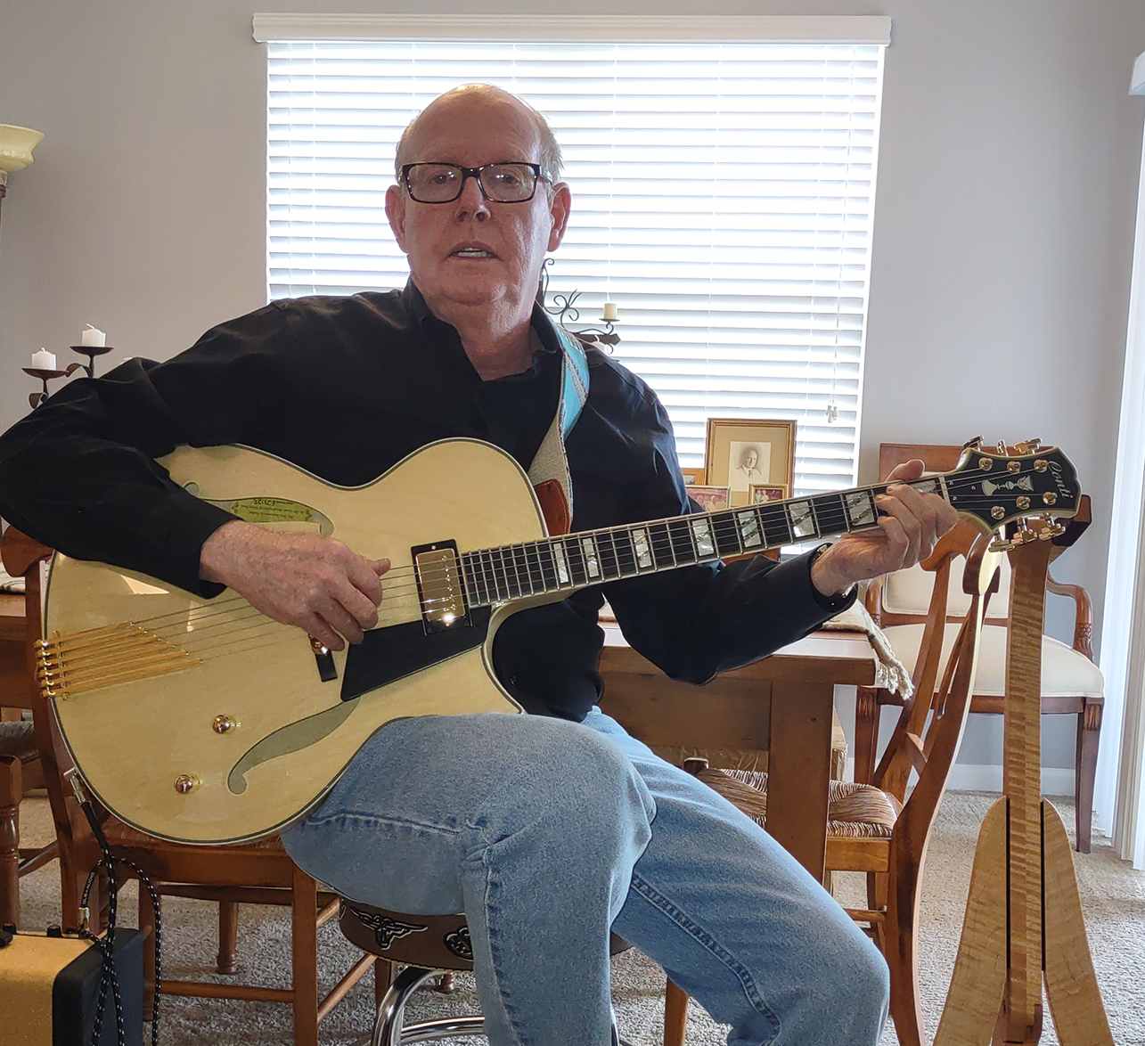 Pete Connelly relaxing at home with his elegant new natural finish Conti Entrada Archtop Jazz Guitar