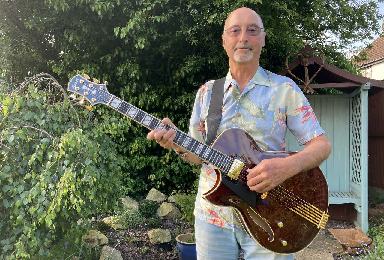 Dave poses with his beautiful new Port Wine Lefty Conti Entrada Archtop Jazz Guitar