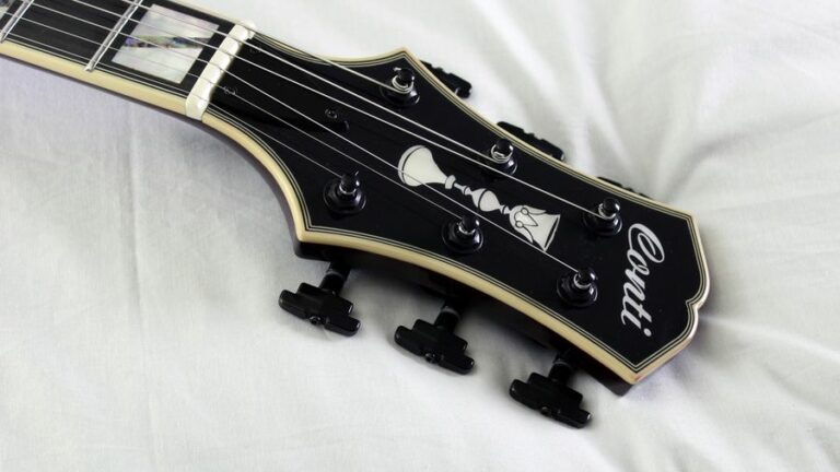 archtop jazz guitar headstock with black tuning keys